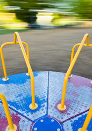 Viewer is along for the ride as this merry-go-round spins greating a blurry background.